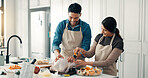 Cooking, chicken and couple in kitchen in house for bonding, connection or preparing meal together. Love, ingredients and man with woman for health, wellness or diet dinner for nutrition in apartment