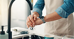 Person, water and washing hands in kitchen for hygiene, germ removal and disinfection for care. Man, faucet and cleaning in home for safety routine, good habit and bacteria prevention at sink