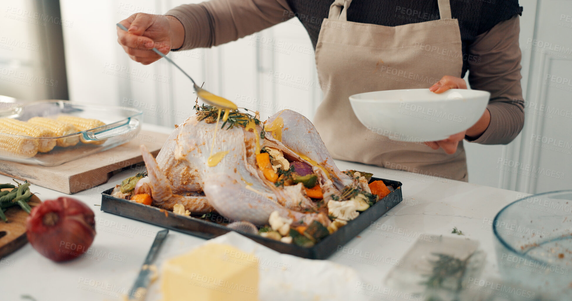 Buy stock photo Hands, chicken and meal prep with sauce in kitchen for thanksgiving recipe or marinade in home. Stuffed turkey, person and preparation with vegetables or ingredients for flavor or seasoning in house
