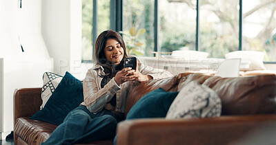 Buy stock photo Woman, relax and typing with phone on sofa, scroll social media and reading notification in home. Cellphone user, connection and search website, download digital app or mobile ebook in living room