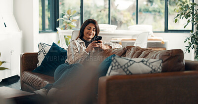 Buy stock photo Woman, smile and reading with phone for sofa, scroll social media and notification in home. Cellphone, connection and search website for download, digital app or mobile ebook and relax in living room