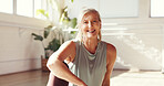 Portrait, yoga and senior woman in studio for fitness, health and rest for holistic exercise. Smile, yogi and person in club for peace, laugh or relax for pilates break with wellness in gym in Canada