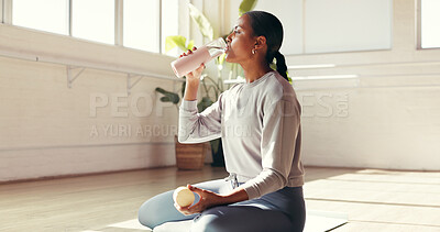Buy stock photo Woman, break or drinking with water in studio for hydration, recovery or natural sustainability. Female person, yogi or thirst with mineral liquid or bottle for fitness workout or rest in health club