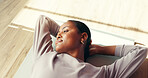 Gym, thinking and woman on mat, resting and tired on floor, smile or wellness with pilates or peace. Above, break and black person in health club, reflection and happy for complete workout or fitness