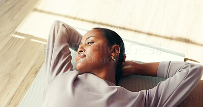 Buy stock photo Gym, thinking and woman on mat, resting and tired on floor, smile or wellness with pilates or peace. Above, break and black person in health club, reflection and happy for complete workout or fitness