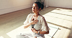 Calm woman, yoga and breathing with meditation in studio for mindfulness, zen or spiritual wellness. Female person, yogi or fitness with balance for awareness, inner peace or fitness on floor or mat