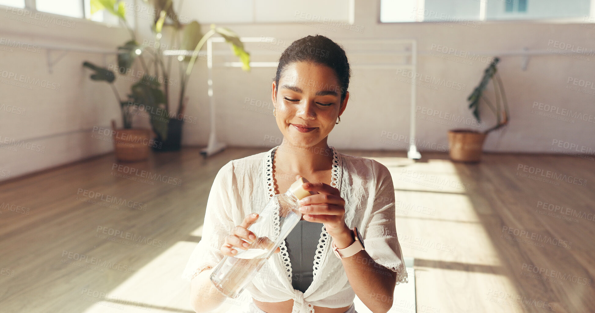 Buy stock photo Yoga, happy and woman with water bottle in studio for exercise, workout and pilates with vitamins. Morning, smile and person with liquid for hydration, wellness and health for break, rest or recovery