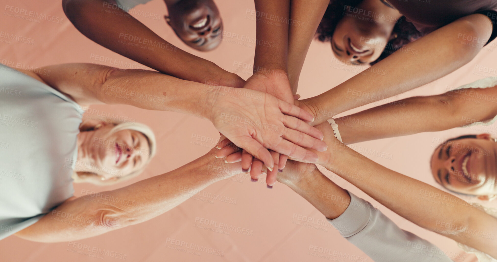 Buy stock photo Below, fitness and women in studio, hands stack and motivation with support, huddle and exercise. Low angle, people and friends with gesture, wellness and circle with health, training and achievement