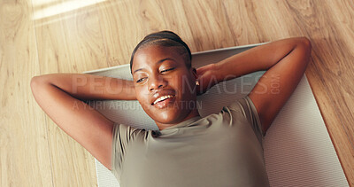 Buy stock photo Gym, smile and woman on mat, resting and tired on floor, thinking or wellness with pilates or peace. Above, break and black person in health club, reflection and happy for complete workout or fitness