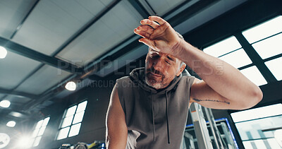 Buy stock photo Fatigue, fitness and man in gym, sweating and wellness with workout, training and tired. Endurance, health center and mature person with exercise, challenge and exhausted with commitment and resting