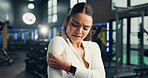 Shoulder pain, exercise and woman in gym, joint injury and inflammation with muscle tension. Massage, fractured and person in health center, discomfort and strain with training accident, sore or hurt