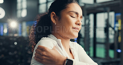 Buy stock photo Shoulder pain, fitness and woman in gym, joint injury and inflammation with discomfort. Massage, fractured and person in health center, muscle tension and strain with training accident, sore and hurt