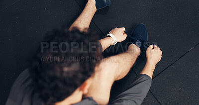 Buy stock photo Above, athlete and tying laces with man at gym of fitness, start exercise and sports training. Male person, sneakers and getting ready for workout, practice preparation and footwear routine of health