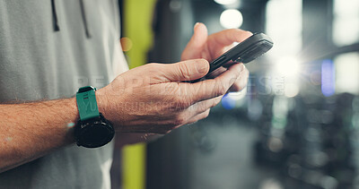 Buy stock photo Fitness, gym and hands of man with phone on mobile app for health, wellness and track workout. Sports center, typing and person on smartphone for internet, exercise website and training progress