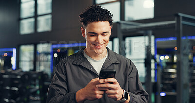Buy stock photo Athlete, online and man with smartphone, gym and communication with contact on social media and web. Fitness, chat and person with mobile on break, happy and typing message with tech in health club