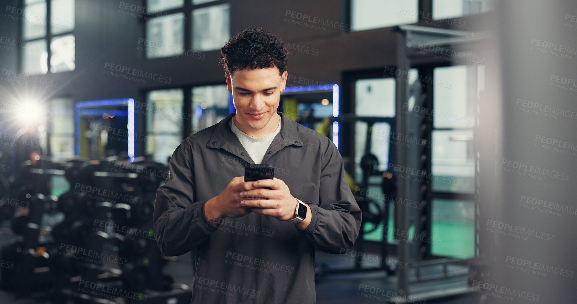 Buy stock photo Texting, man and happy with smartphone, gym and communication with contact on social media and chat. Online, athlete and person with mobile on break, fitness and message with tech in health club