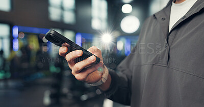 Buy stock photo Fitness, gym and hands of person with phone on mobile app for health, wellness and track workout. Sports center, typing and man on smartphone for internet, exercise website and training progress