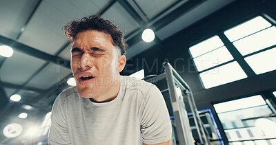 Buy stock photo Tired, fitness and man in gym, sweating and wellness with fatigue, training and challenge. Endurance, health center and person with exercise, break and exhausted with commitment, rest and lens flare