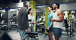 Group, athlete and people talk in gym for fitness, exercise advice and training feedback. Men, woman and discussion for sports workout, physical activity and tips for strong muscle in health centre