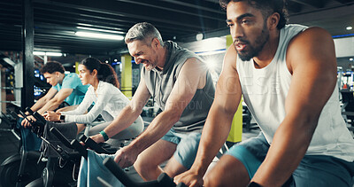 Buy stock photo Exercise bike, people and group in gym for fitness, intense challenge or workout for health. Cycling, man and training in sport club with stationary bicycle for spin class, cardio wellness or flare