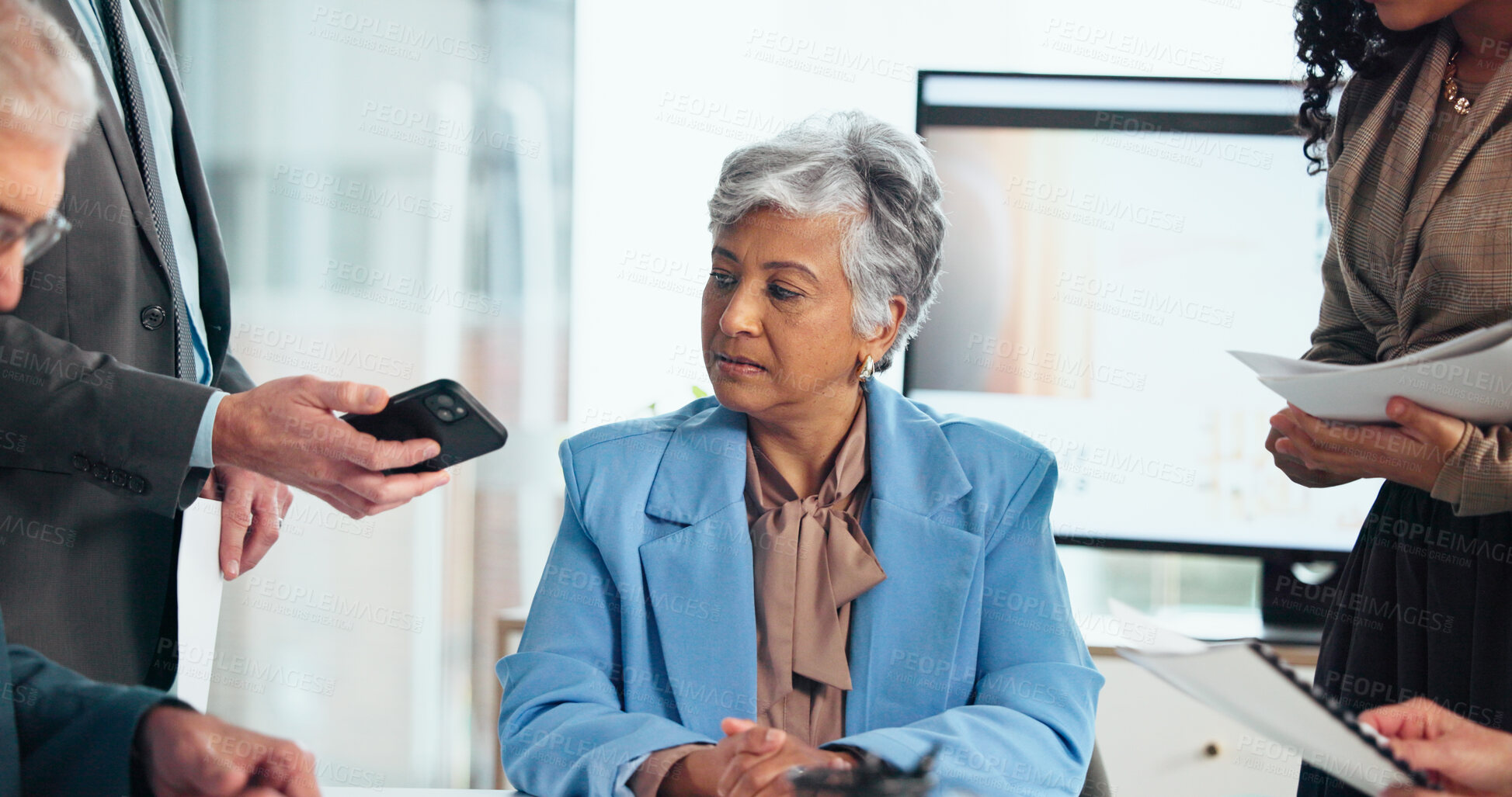 Buy stock photo Business woman, multitasking and staff with phone call, documents and notification with stress at office. Mature person, leader and team with paperwork, smartphone and serious at insurance company