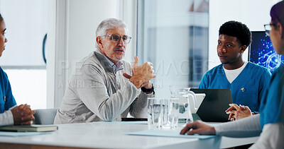 Buy stock photo Man, medical director and meeting with team for clinic funding, discussion or improvement. Mature, male person or CEO of healthcare group in conference for proposal, budget or development in hospital