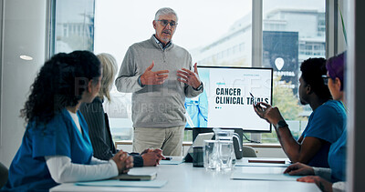 Buy stock photo Man, meeting and presentation with medical team for cancer awareness, clinical trial or workshop. Male person, oncology or group of employees in conference for healthcare campaign on global disease