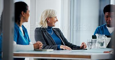 Buy stock photo Doctors, laughing and business woman in meeting for hospital manager, surgery schedule and healthcare. Medical, planning and nurses with mature person in boardroom for clinic report and joke
