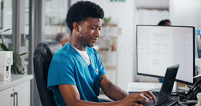 Buy stock photo Man, nurse and typing with laptop for online booking, administration or medical appointment. Male person, clinic reception and health admin with computer at front desk for planning visit or schedule