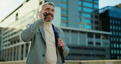 Buy stock photo Happy, businessman or realtor with phone call in city for property, conversation or discussion. Mature, man or corporate real estate agent with smile on mobile smartphone for urban settlement in town
