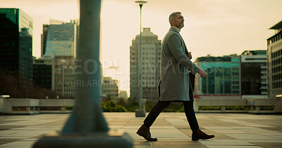 Buy stock photo Walking, employee and mature man in city, urban planner and journey to work, commuting or traveller. Morning, commuter and person with ambition for career growth, travel and pride for opportunity