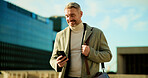 Phone, smile and business man in city for travel, check schedule or update with urban planner. Outdoor, mobile or mature employee on commute, communication and reading text for development approval