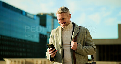 Buy stock photo Mobile, smile and business man in city for travel, check schedule or update with urban planner. Outdoor, phone and mature employee on commute, communication and reading text for development approval