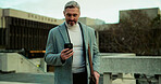 Mobile, travel and business man in city for chat, check schedule or update with urban planner. Outdoor, phone and mature employee on commute, email or reading text for infrastructure development