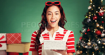 Buy stock photo Woman, Christmas in studio and surprise for gift, box and holiday celebration with reaction on green background. Wow, bokeh and female person with happiness for present, tradition or xmas package