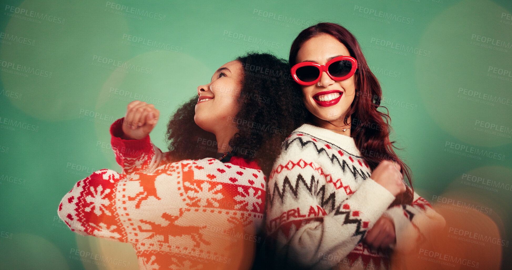 Buy stock photo Christmas, friends and women dance in studio for celebration at festive event on green background. Xmas season, happiness and girls moving with rhythm for holiday, energy and party music with bokeh