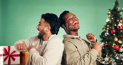 Buy stock photo Dance, Christmas and excited friends in studio for holiday season, party and festive event. Happiness, xmas vacation and energy with people on green background for December, bonding or smile together