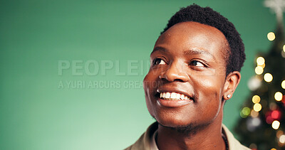 Buy stock photo Christmas, thinking and smile with black man in studio for decision, holiday season and gift planning. Festive tradition, reflection and mockup space with person on green background for bokeh