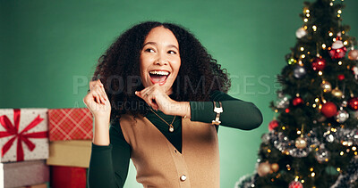 Buy stock photo Christmas, excited and woman dance in studio for celebration at festive event on green background. Xmas, happiness and girl moving with rhythm for energy, holiday tradition or laugh with party music