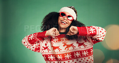 Buy stock photo Happy, woman and dancing in studio for Christmas holiday, xmas party and celebration. Smile, African person and sunglasses with bokeh, moving rhythm and energy for festive season on green background