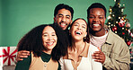Christmas, portrait and happy friends laugh in studio for holiday, festive season or funny. Xmas, women and men smile for celebration with tree decoration, present or support on green background