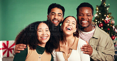 Buy stock photo Christmas, portrait and happy friends laugh in studio for holiday, festive season or funny. Xmas, women and men smile for celebration with tree decoration, present or support on green background