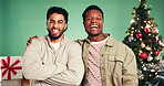 Christmas, portrait and friends in studio for celebration, support and holiday season. Laughing, festive event and xmas vacation with excited people on green background for December party together