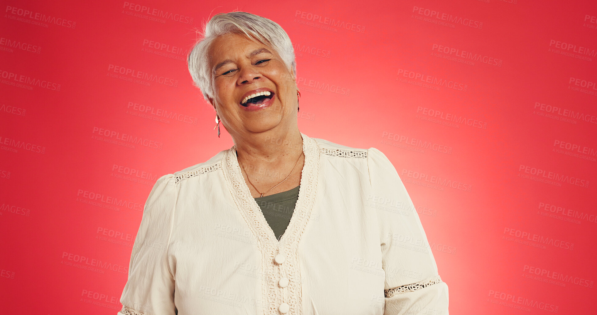 Buy stock photo Happy, laugh and senior woman in studio with funny joke, humor reaction and positive attitude. Mockup space, retirement and mature person with comic, goofy emotion and silly on red background