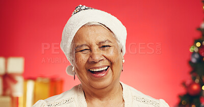 Buy stock photo Happy, Christmas and portrait of senior woman in studio with decorations for festive tradition. Smile, santa hat and elderly female person from Mexico with pride for xmas holiday by red background.
