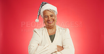 Buy stock photo Christmas, happy and portrait of mature woman in studio for holiday, vacation and festive season. Mockup space, hat and person for tradition, xmas celebration and December event on red background