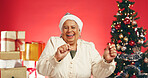 Dance, Christmas and portrait of old woman in studio for holiday season, celebration or xmas cheer. Festive tradition, excited and December vacation with senior person on red background for happiness