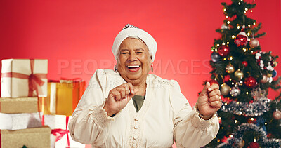 Buy stock photo Dance, Christmas and portrait of old woman in studio for holiday season, celebration or xmas cheer. Festive tradition, excited and December vacation with senior person on red background for happiness