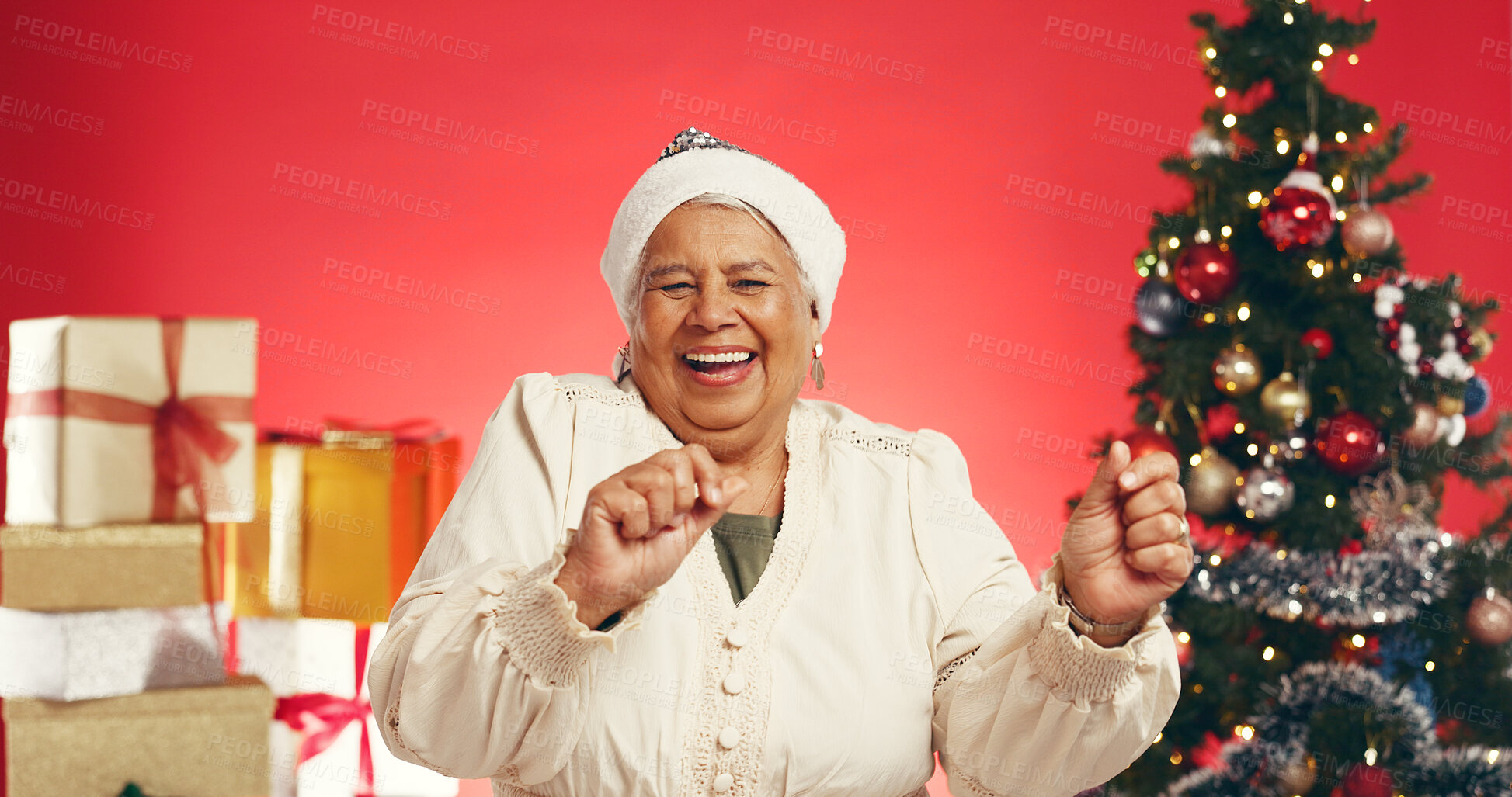 Buy stock photo Dance, Christmas and portrait of old woman in studio for holiday season, celebration or xmas cheer. Festive tradition, excited and December vacation with senior person on red background for happiness