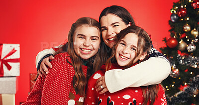 Buy stock photo Portrait, children and hug with mom, Christmas or happy on festive event, studio or December holiday. Love, woman and bonding with kids on Xmas season, red background and decorations for tree in USA